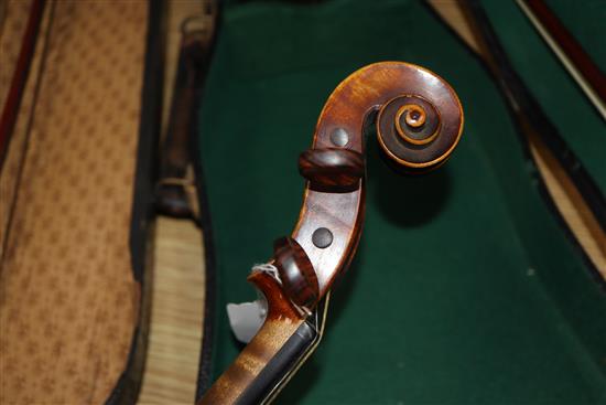 A German Strad style violin and a small violin and two bows